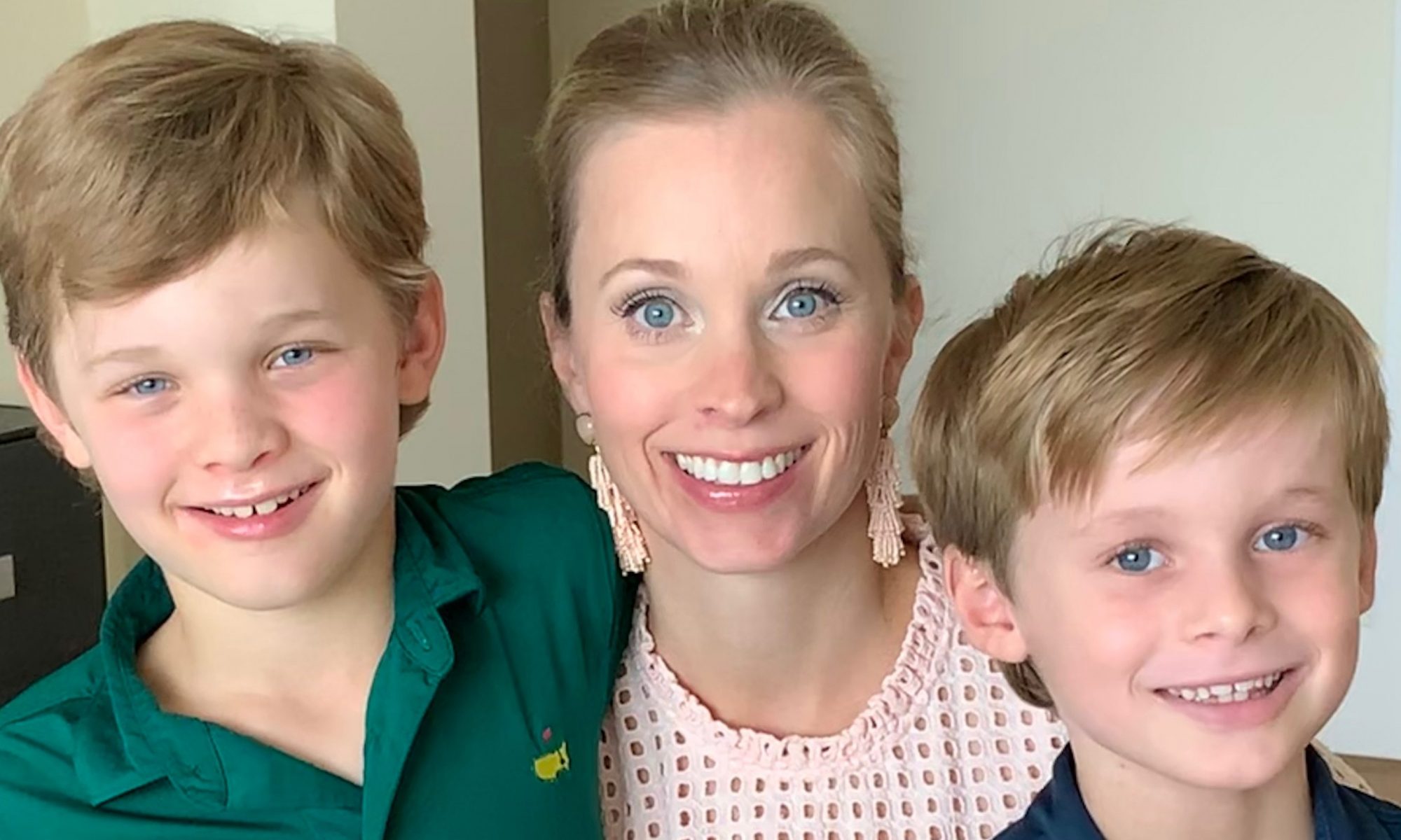 mom-with-two-boys-smiling-at-camera