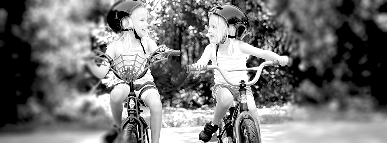blond-sisters-ride-bikes-with-training wheels-by-amber-faust-on-unsplash