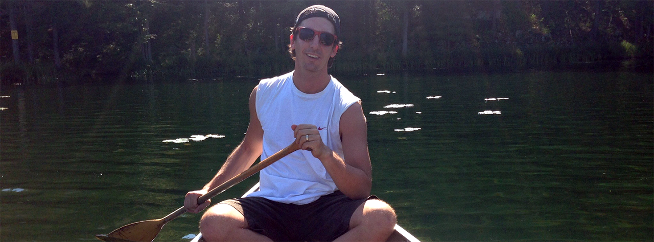 kyle-dine-equal-eats-founder-paddles-canoe-on-green-water