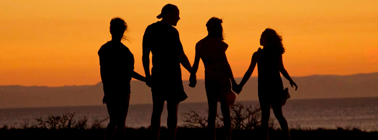family-at-sunset-on-beach-silhouette-by-mike-scheid-on-unsplash