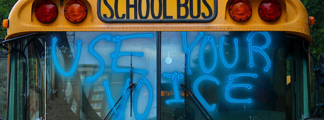 school-bus-window-has-use-your-voice-written-on-it-by-stephen=harlan-on-unsplash-food-allergy-advocacy