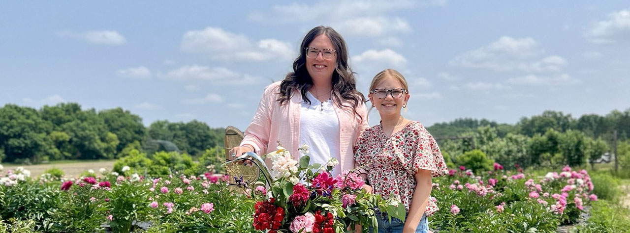 guest-author-kiley-oesterreich-with-daughter-with-food-allergies-in-field-of-flowers
