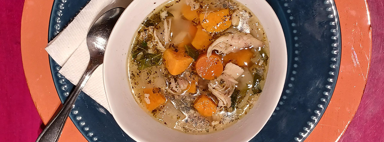 Leftover Soup made by Allergy Dragon/Chef Martha Morgan using leftover chicken, onion, carrots, bok choy and sweet potatoes plus ground sage, rosemary and thyme. Waste not. Want not.