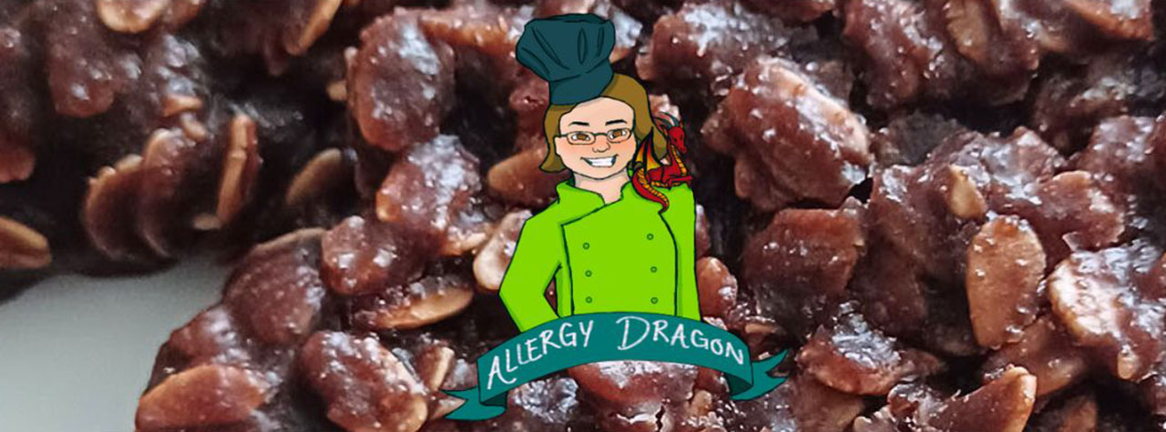 Mouthwatering homemade whole grain chocolate cookies. Allergy Dragon logo with smiling chef in a green jacket and grey toque. Image of cookies and logo from Allergy Dragon.