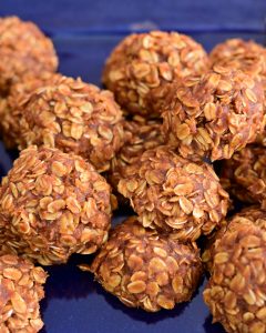 Mouthwatering homemade whole grain pumpkin cookies on a rustic, dark blue platter. Image by MBR Imaging.
